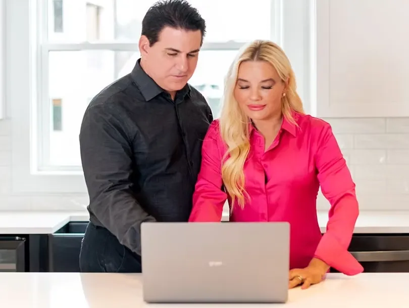 Tammy and Andrew looking at laptop