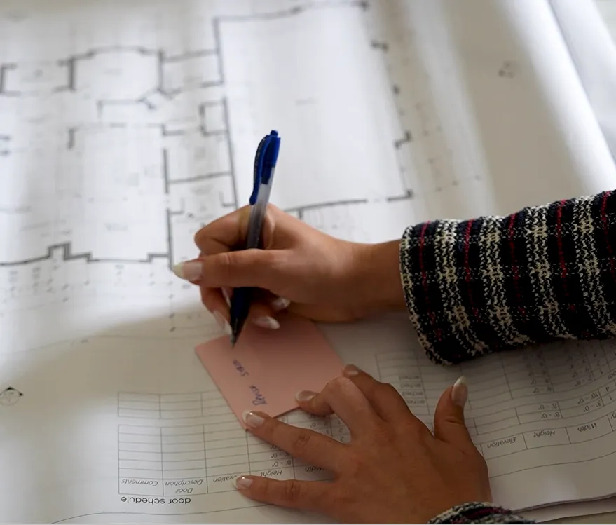 MIP employees making notes on floor plan